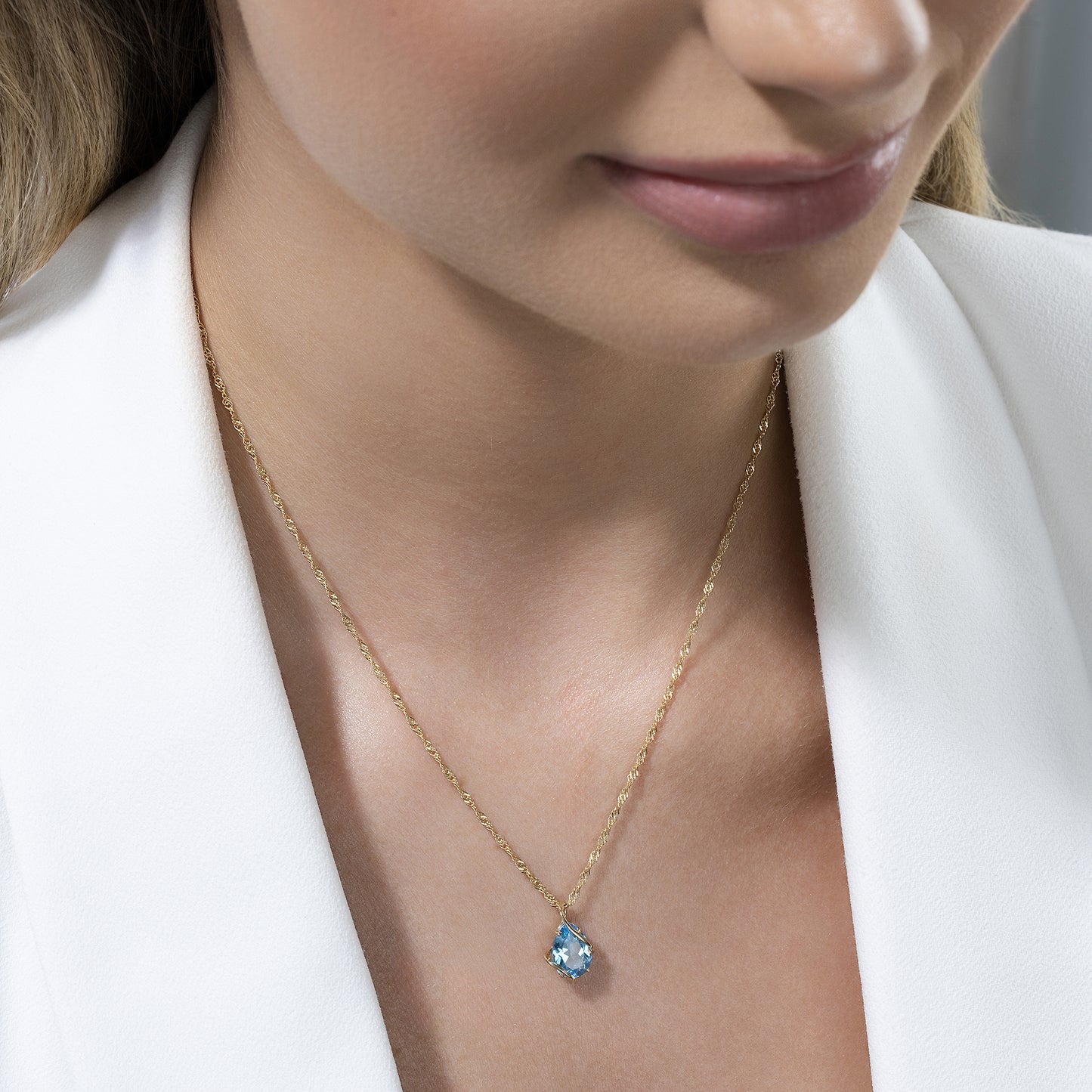 Anhänger mit Kette Singapurkette 375/- Gold 43cm Blautopas beh.